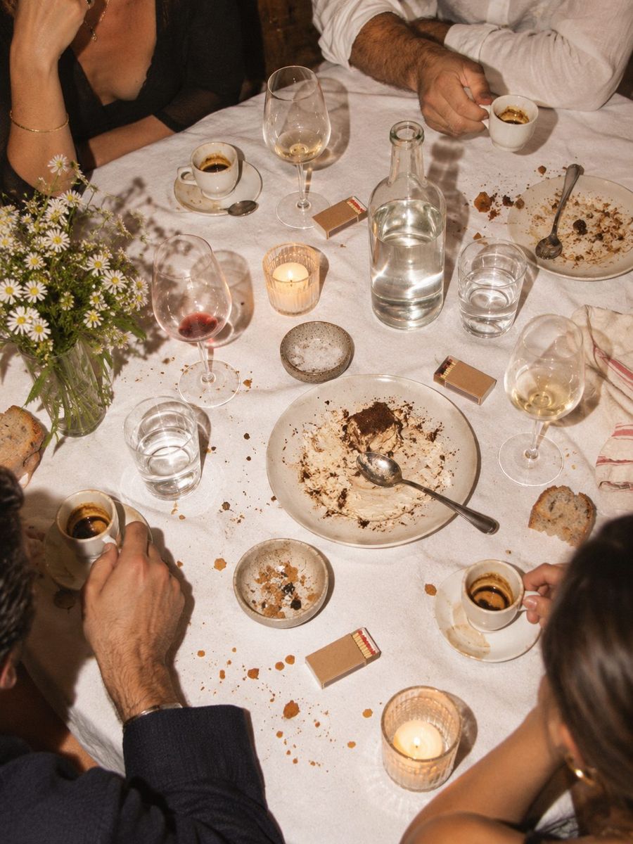 Espresso cups, matchboxes and an empty tiramisu plate